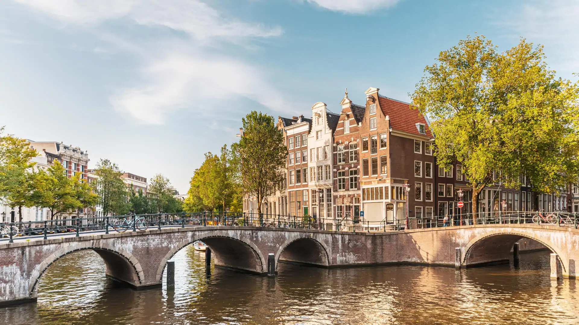 dest_netherlands_amsterdam_bridge_canal_gettyimages-1172736144_universal_within-usage-period_79471