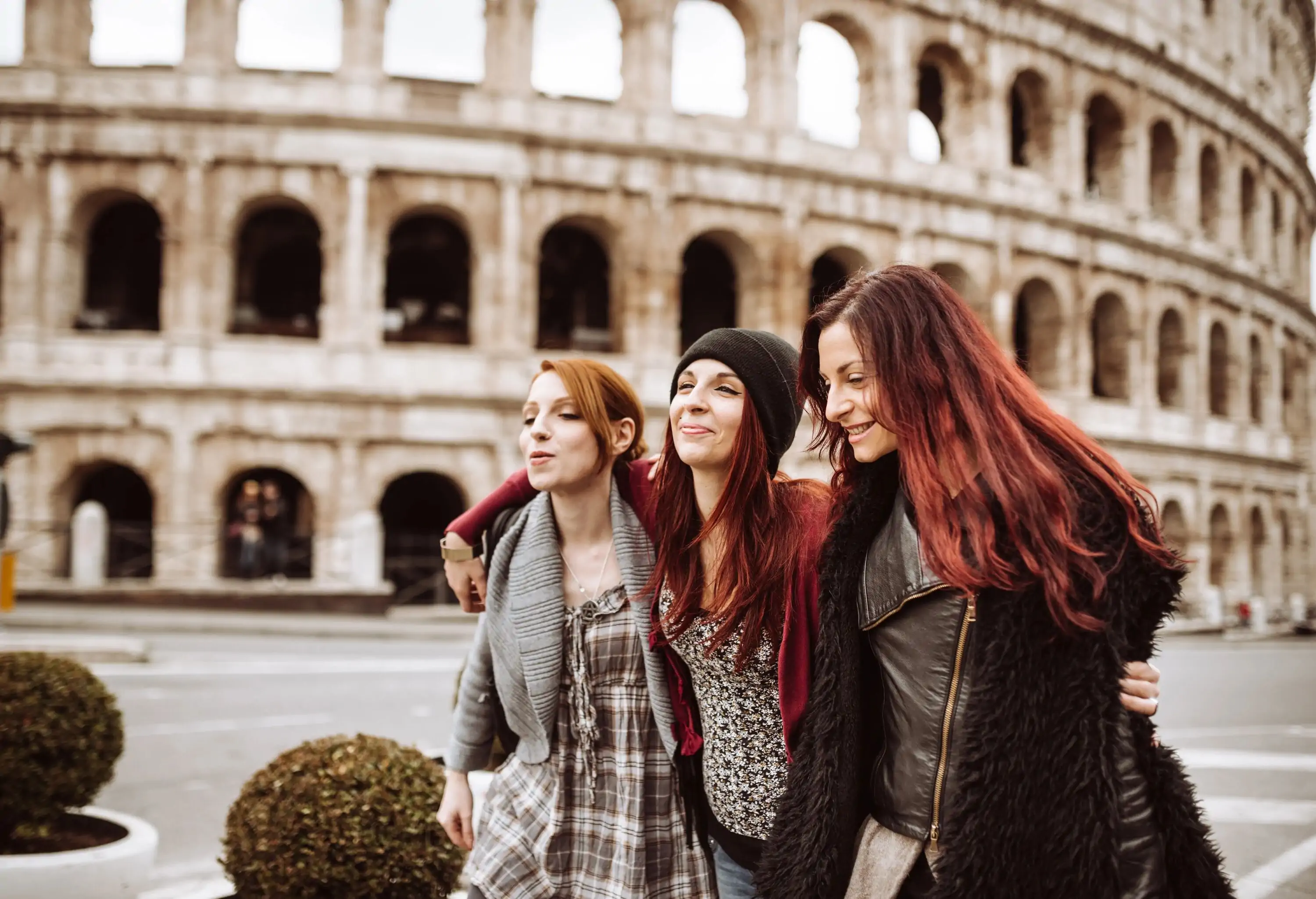 tourists in rome take walking under the coliseum