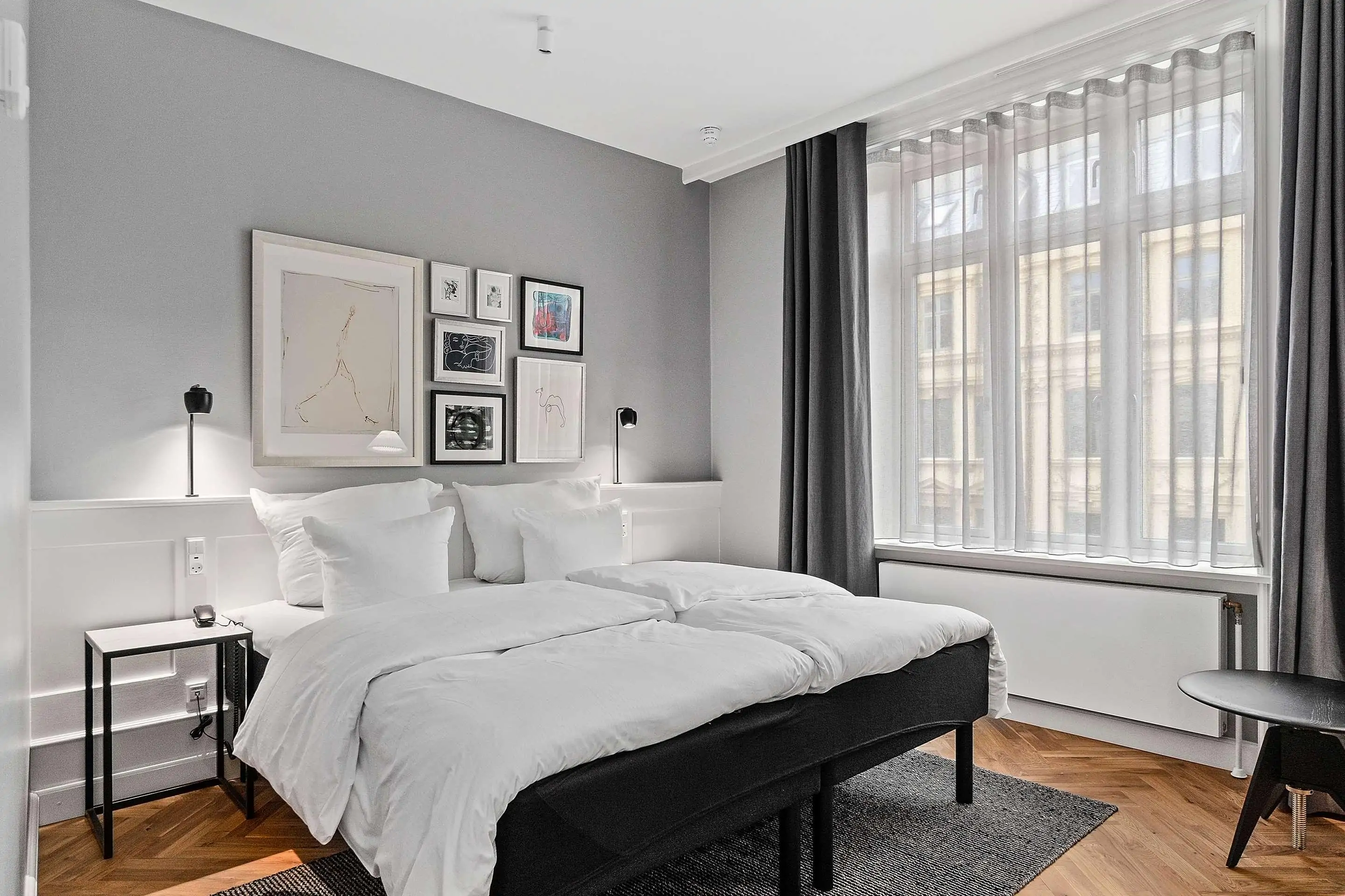 Contemporary hotel room with grey colour palette