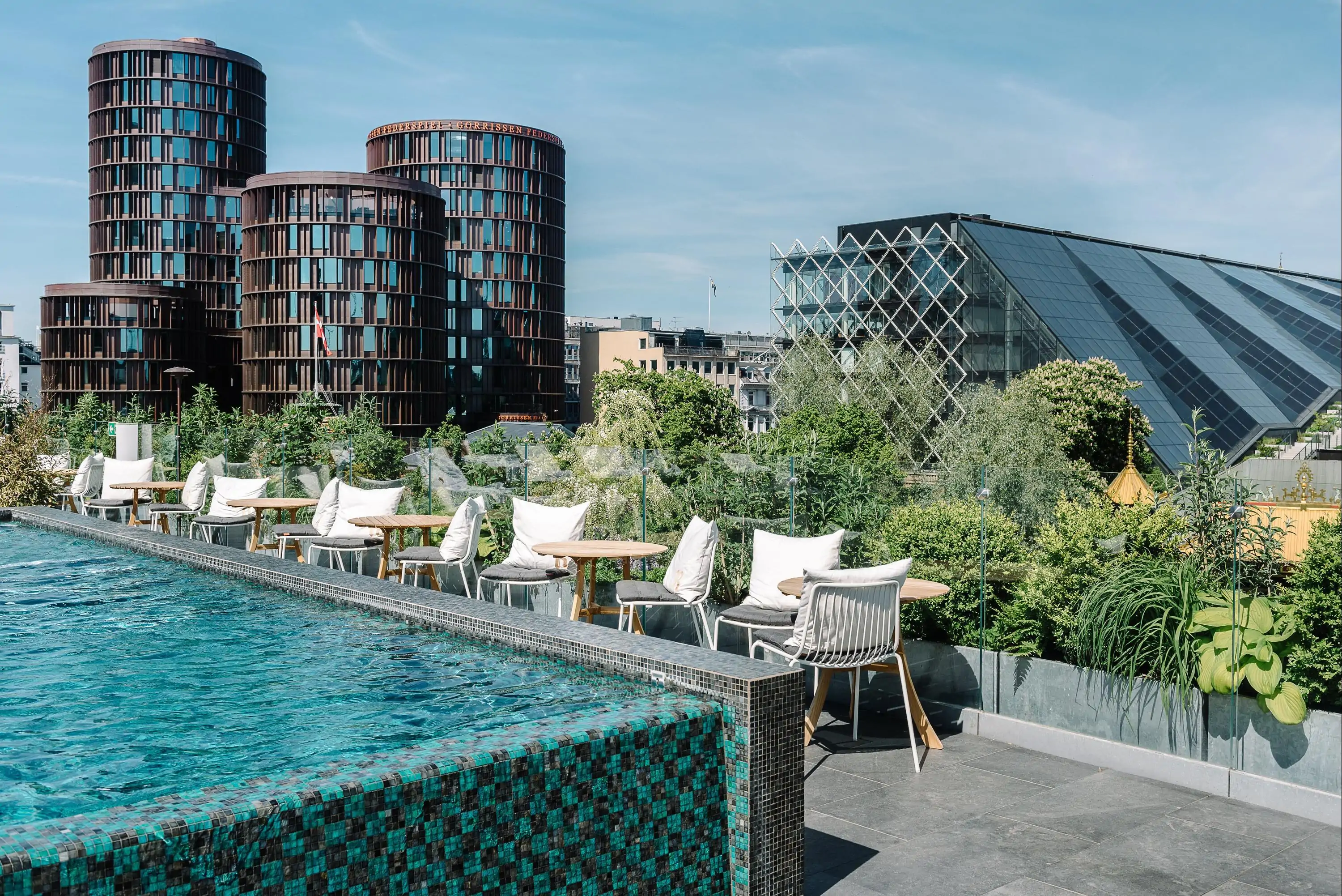 Modern rooftop with open air pool looking over city