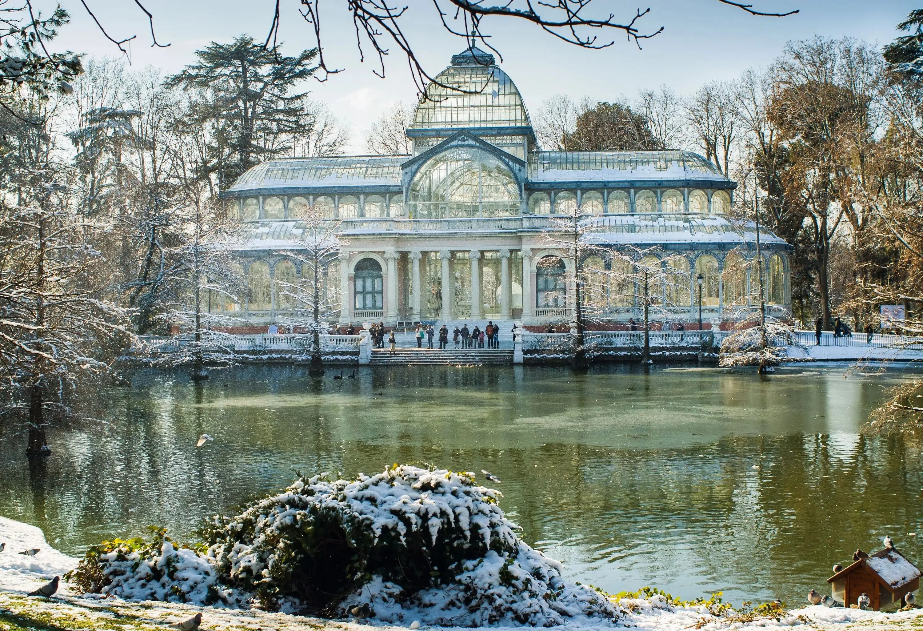 sight of the crystal palace in the retiro park, madrid Spainon a frosty and snowy winter day