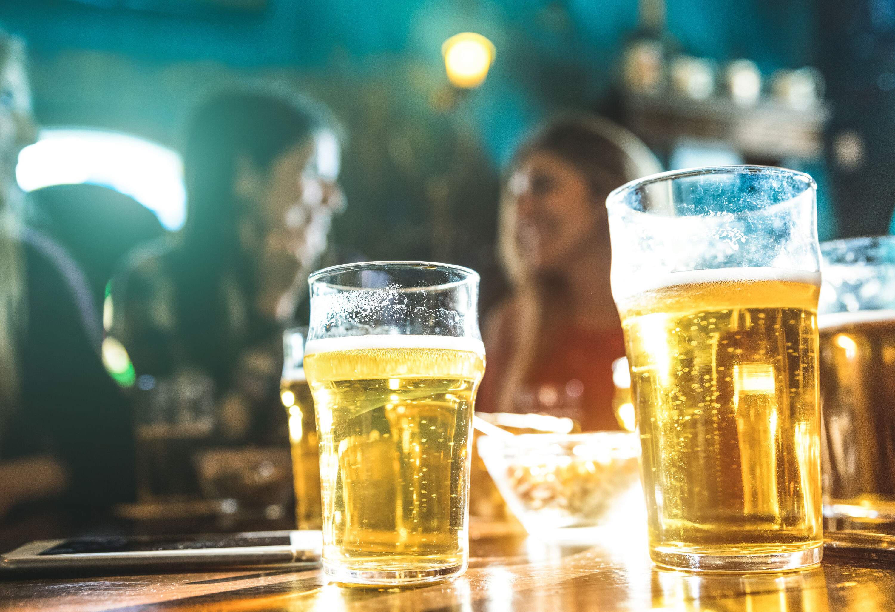 Glasses of beer on a table.