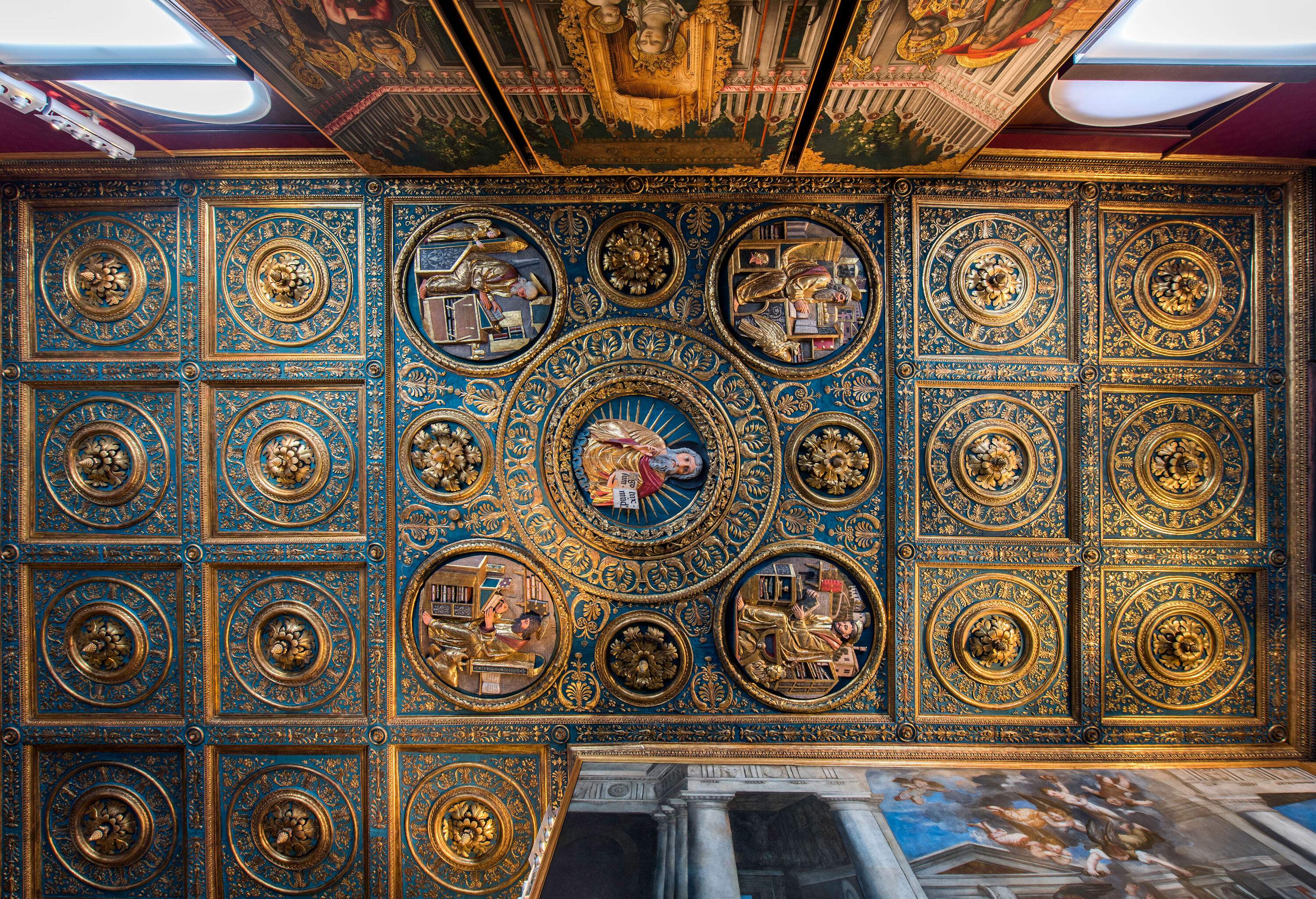 A captivating ceiling adorned with exquisite artistry and intricate details is found within the Gallerie dell'Accademia.