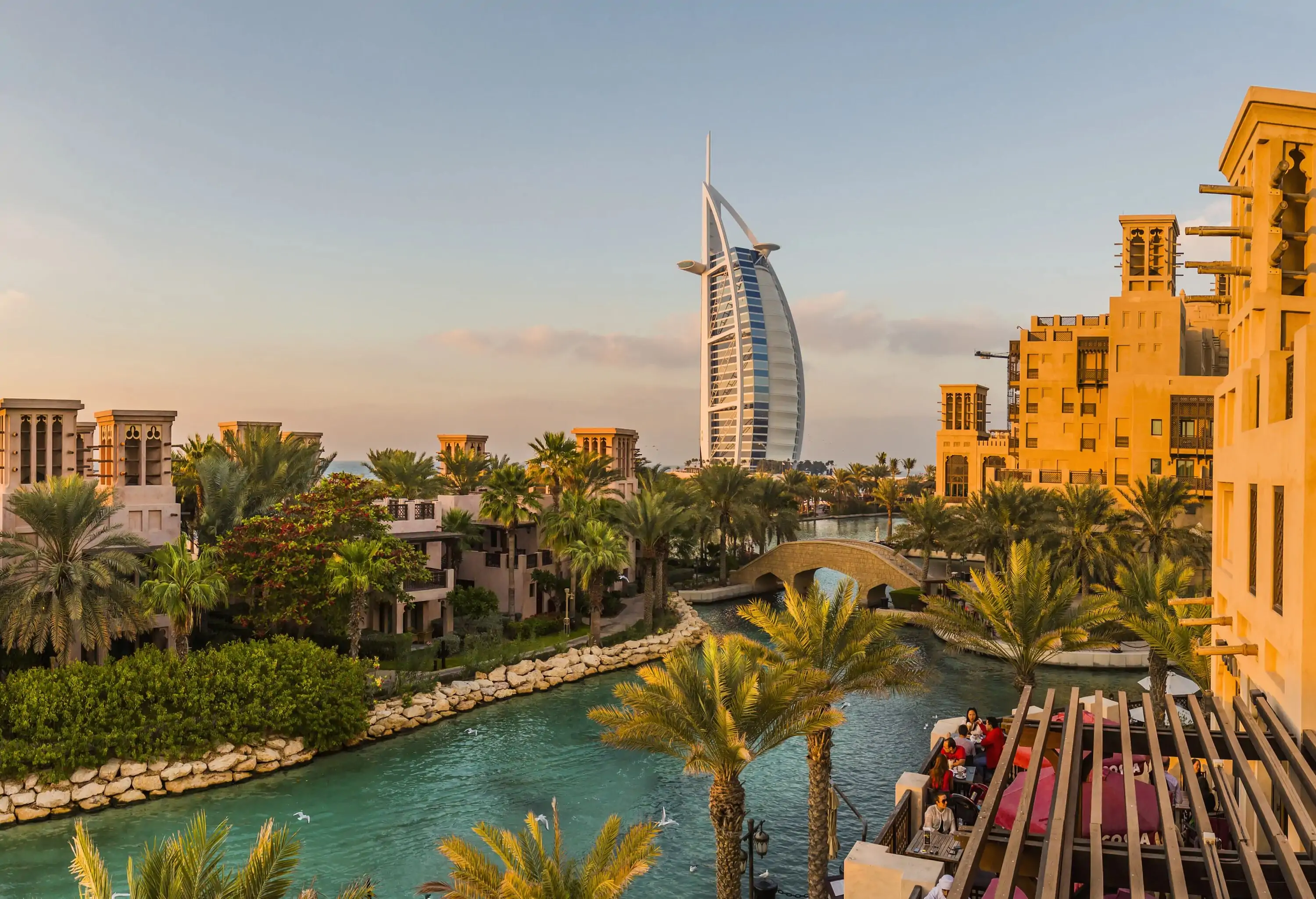 The elegant waterside buildings on the Jumeirah strip with the Burj Al Arab in the background.