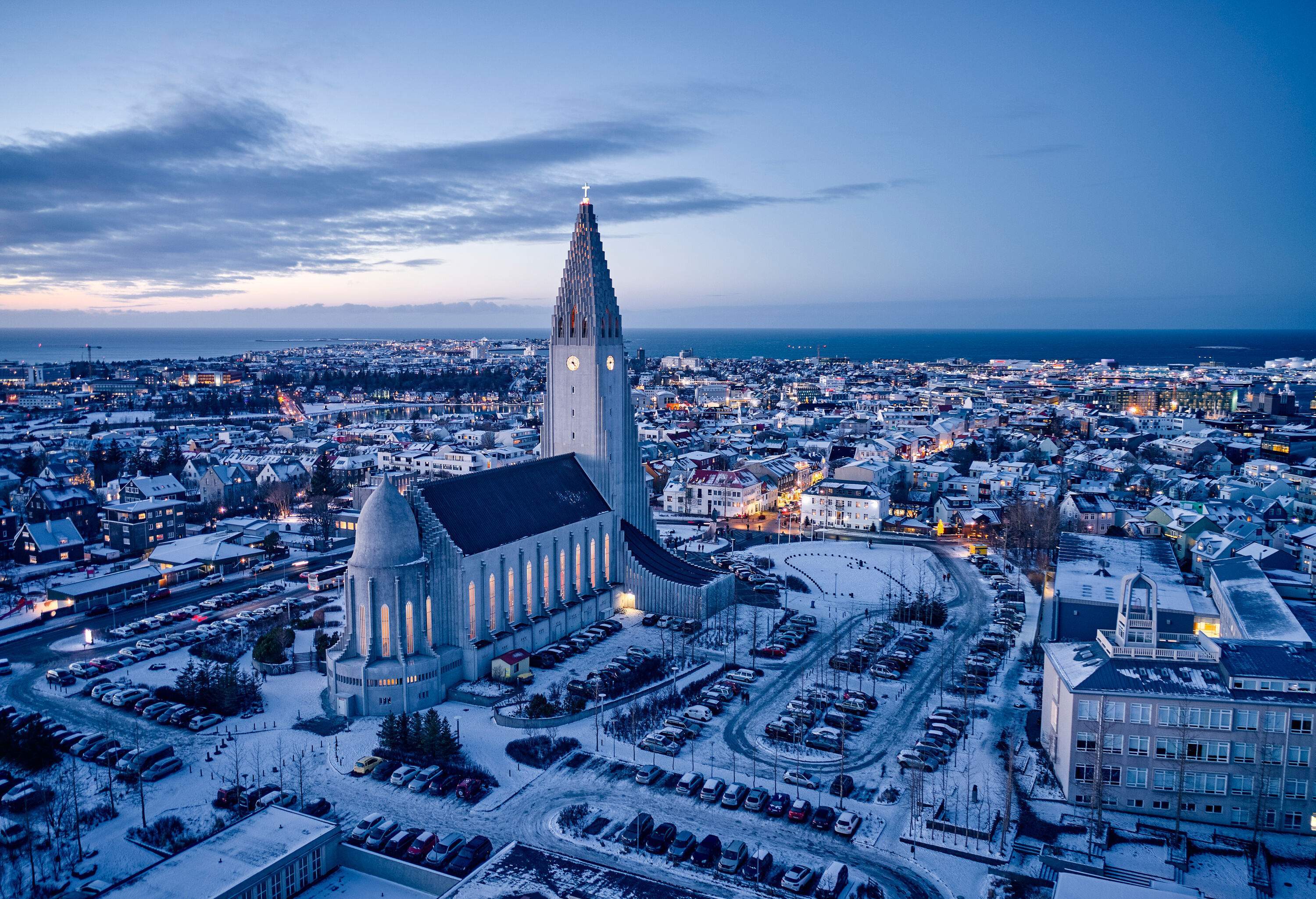 Reykjavík's snow-covered cityscape featuring the famed Hallgrímskirkja church.