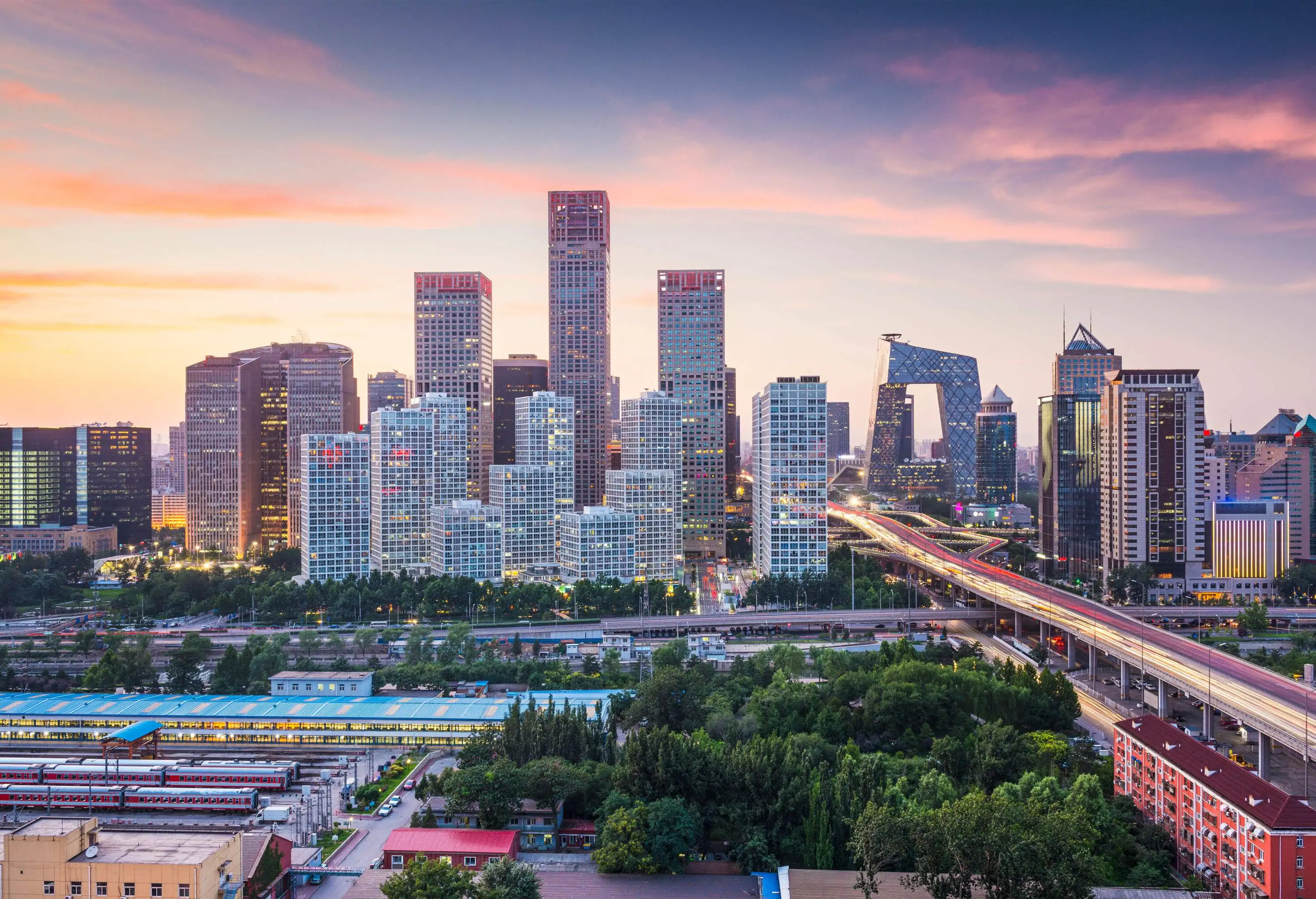 China skyline at the central business district, with a magnificent long elevated bridge gracefully spanning the vibrant urban landscape.