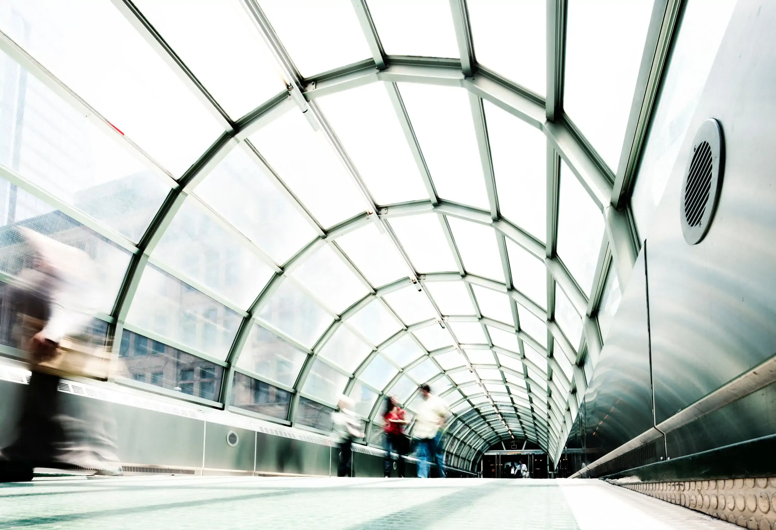 Blurs of people in a modern walkway. Toronto, Canada