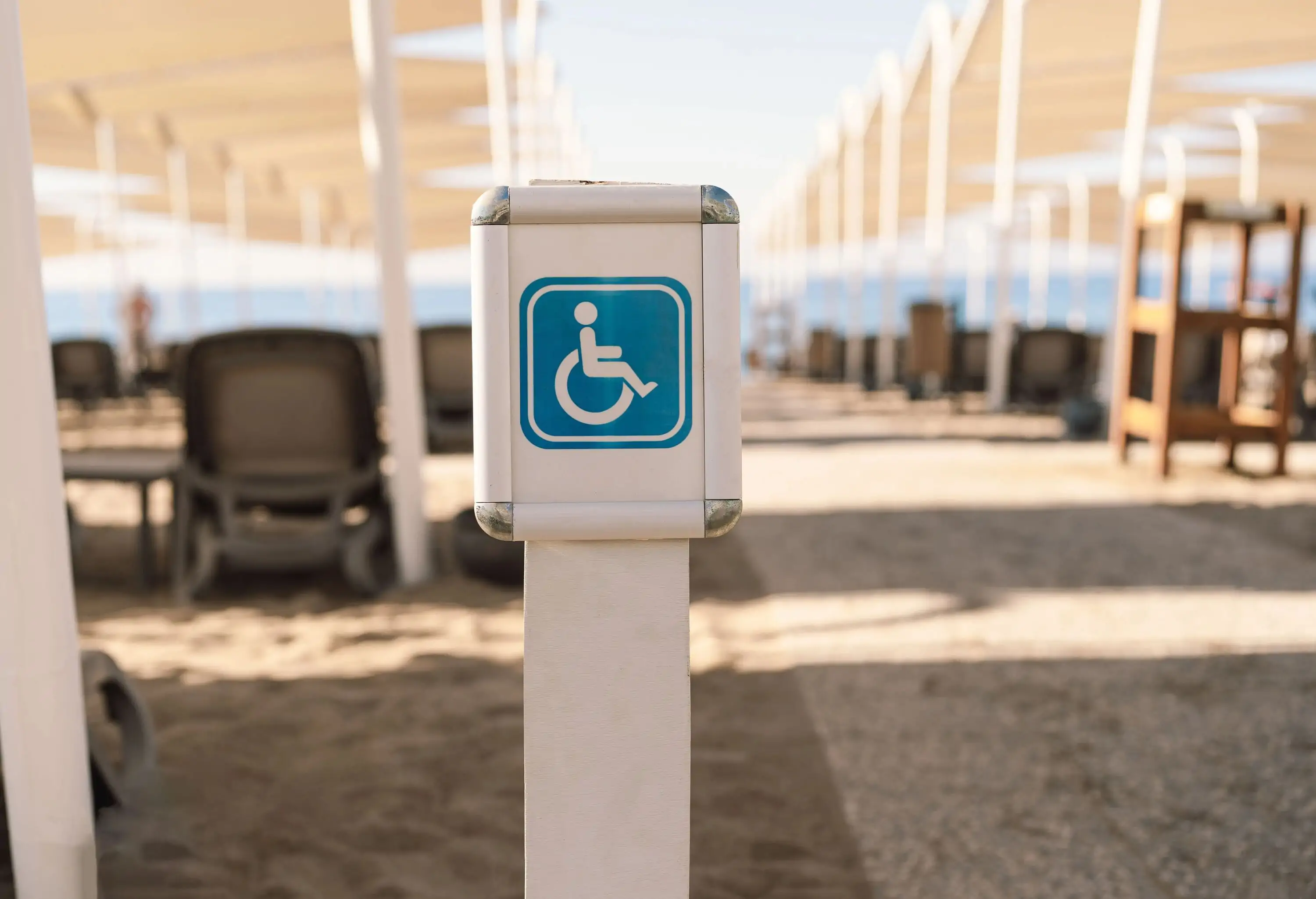 Disability sign on the sea beach