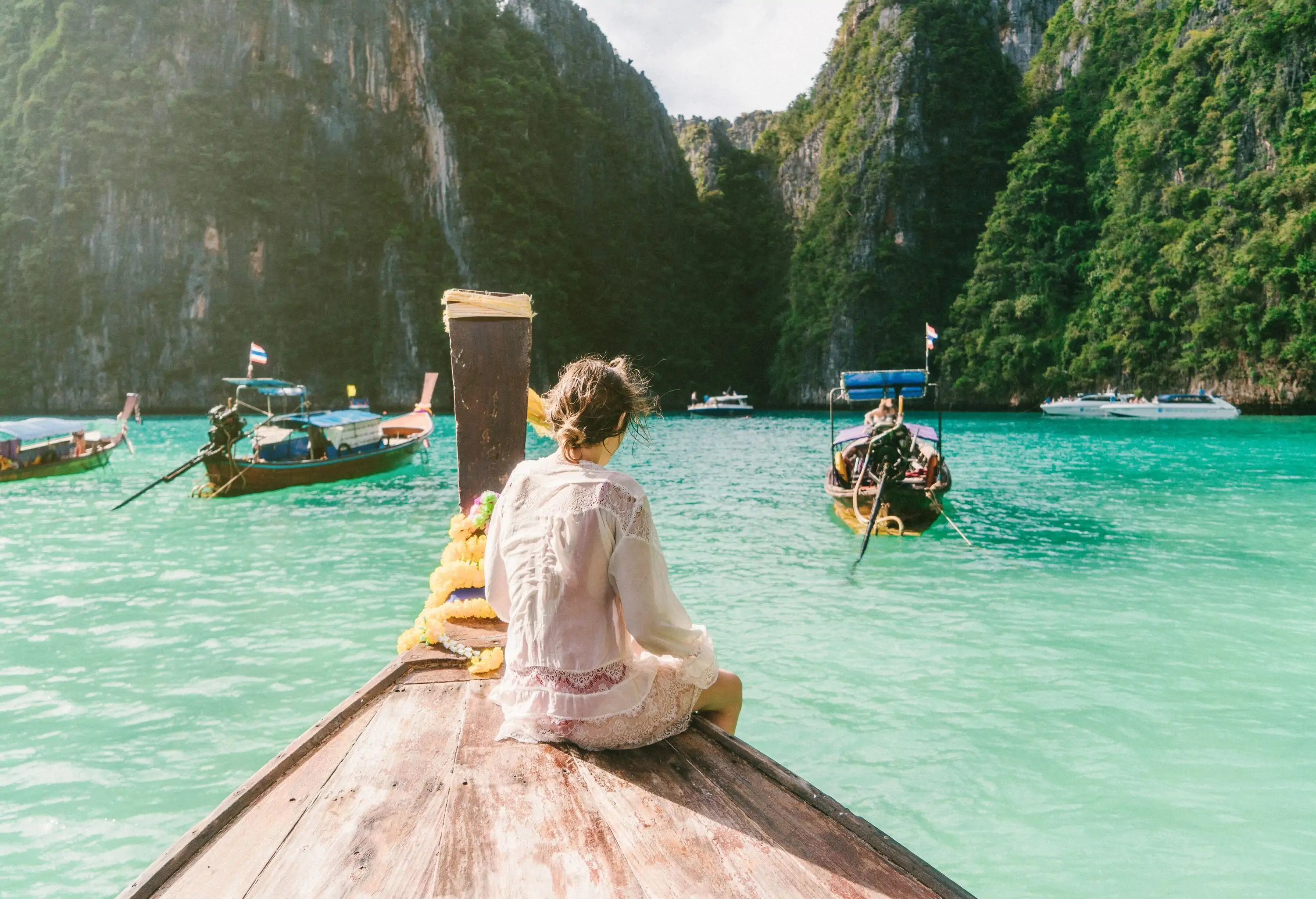 Young Caucasian woman in Thai Taxi boat in Krabi, Thailand