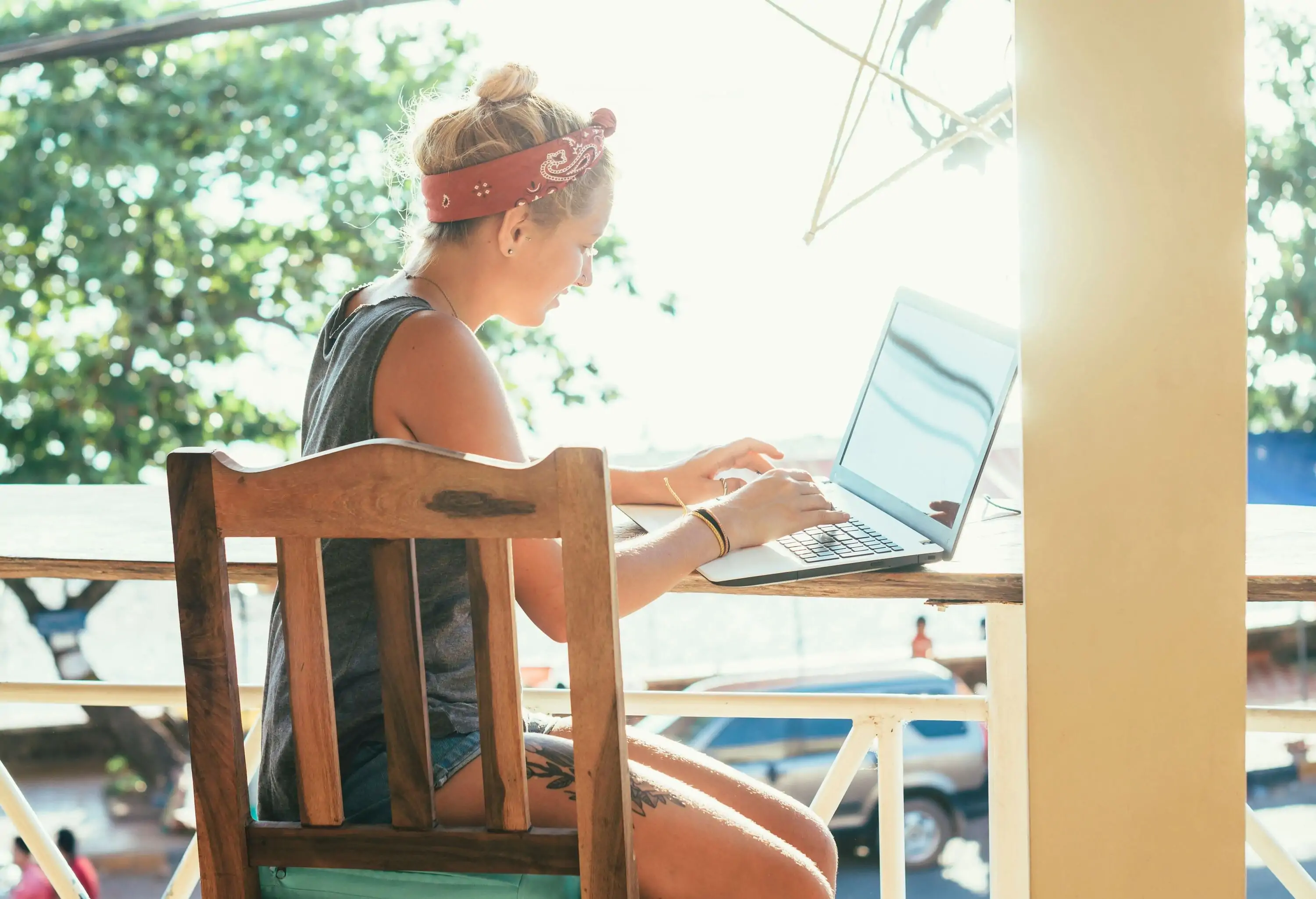 Girl on laptop while travelling