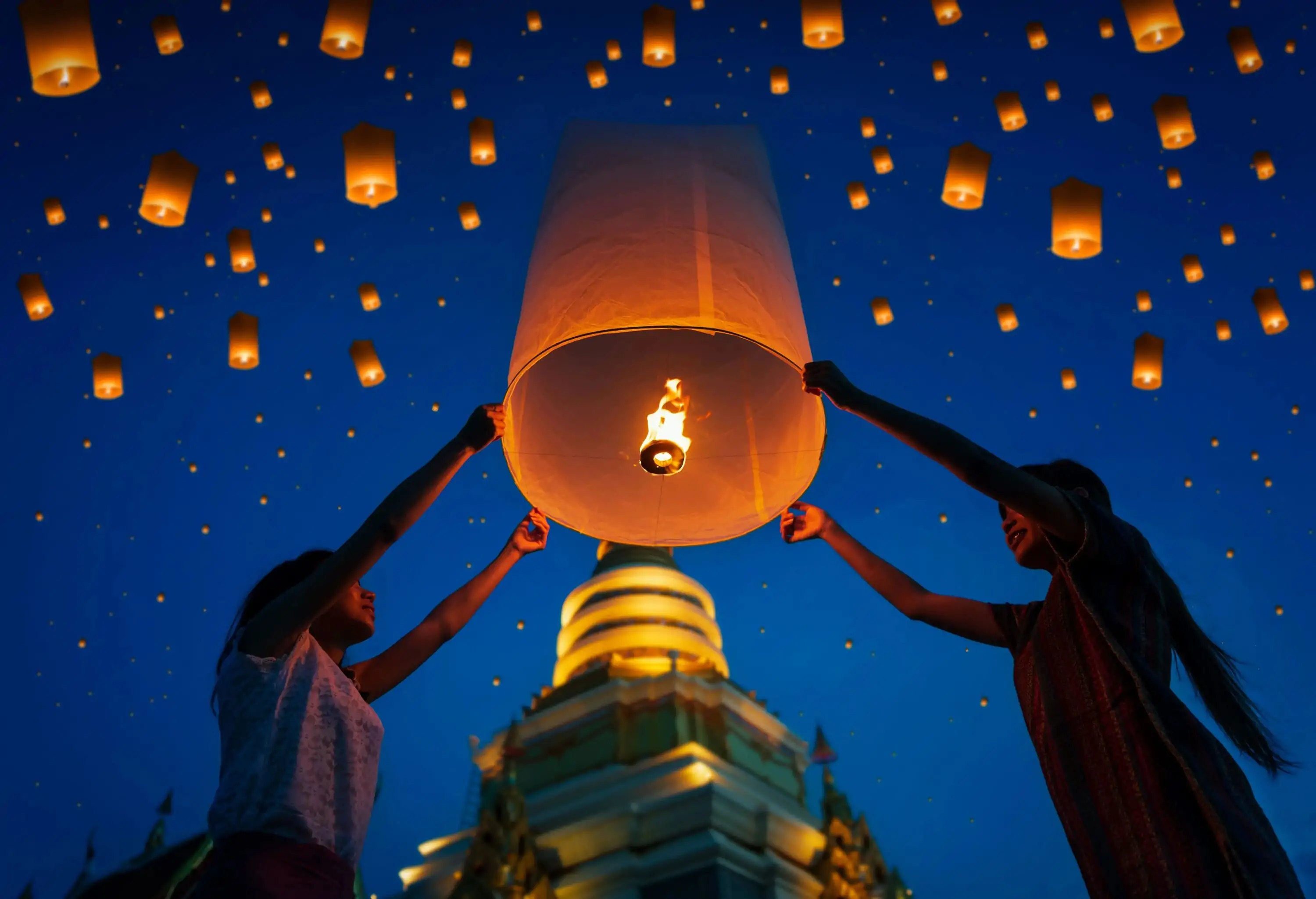 People floating lamp in Yi Peng festival at Chiangmai Thailand